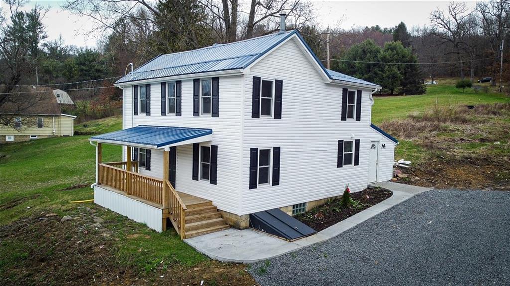 416 Oneida Valley Road Butler, PA 16001 - Photo 1 of 40 a front view of a house with garden