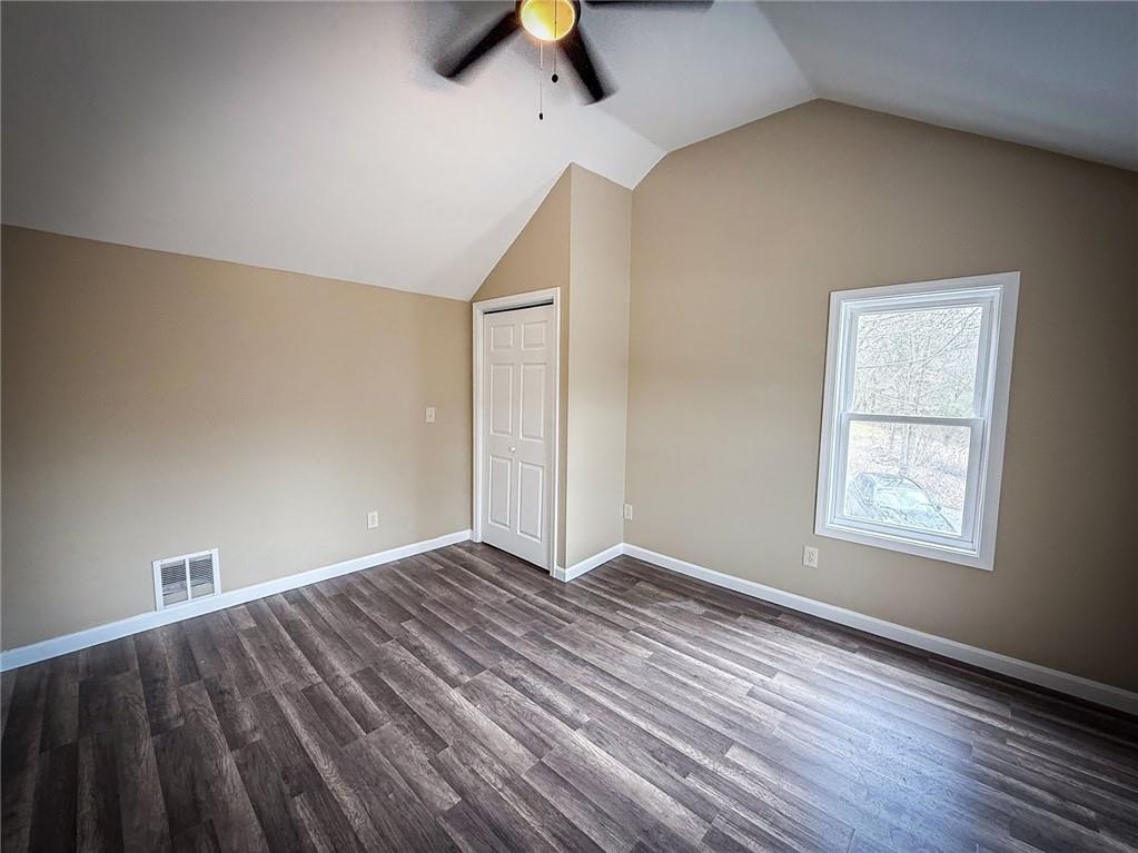 416 Oneida Valley Road Butler, PA 16001 - Photo 13 of 40 an empty room with wooden floor and windows