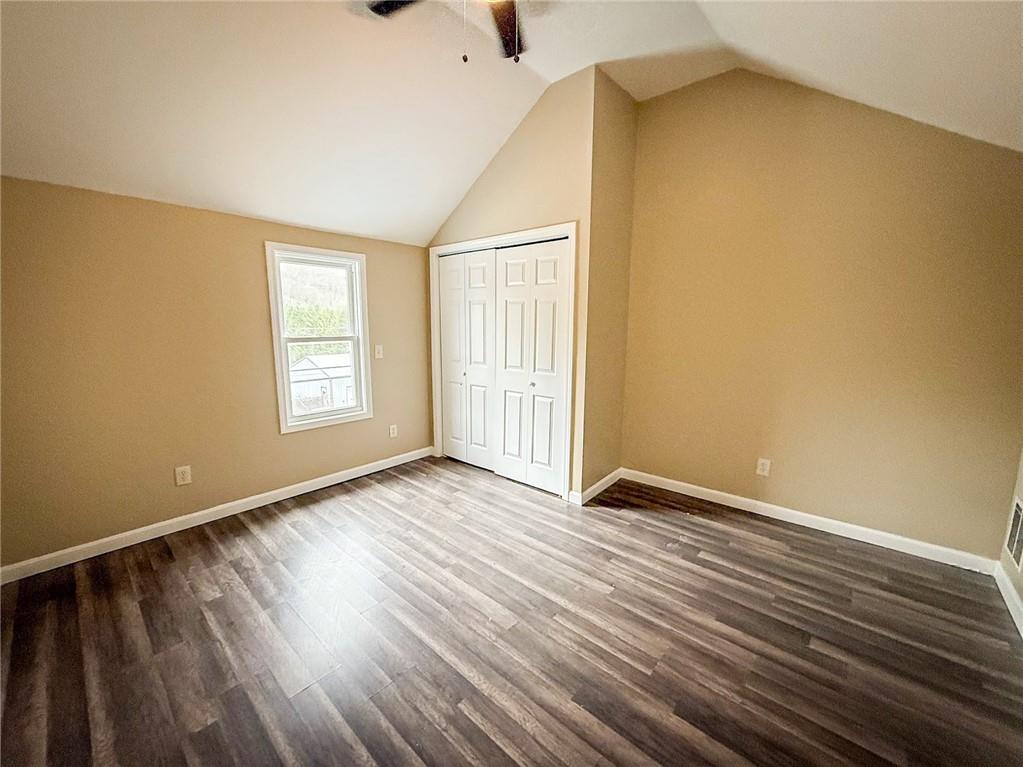 416 Oneida Valley Road Butler, PA 16001 - Photo 15 of 40 a view of an empty room with wooden floor and a window