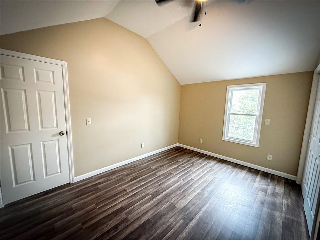 416 Oneida Valley Road Butler, PA 16001 - Photo 17 of 40 a view of an empty room with wooden floor and a window