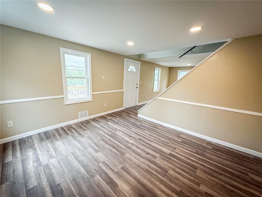 416 Oneida Valley Road Butler, PA 16001 - Photo 20 of 40 a view of an empty room with wooden floor and a window