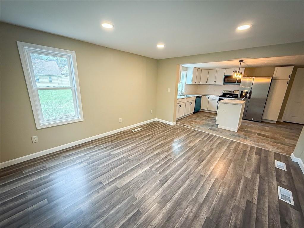 416 Oneida Valley Road Butler, PA 16001 - Photo 22 of 40 an empty room with wooden floor and windows
