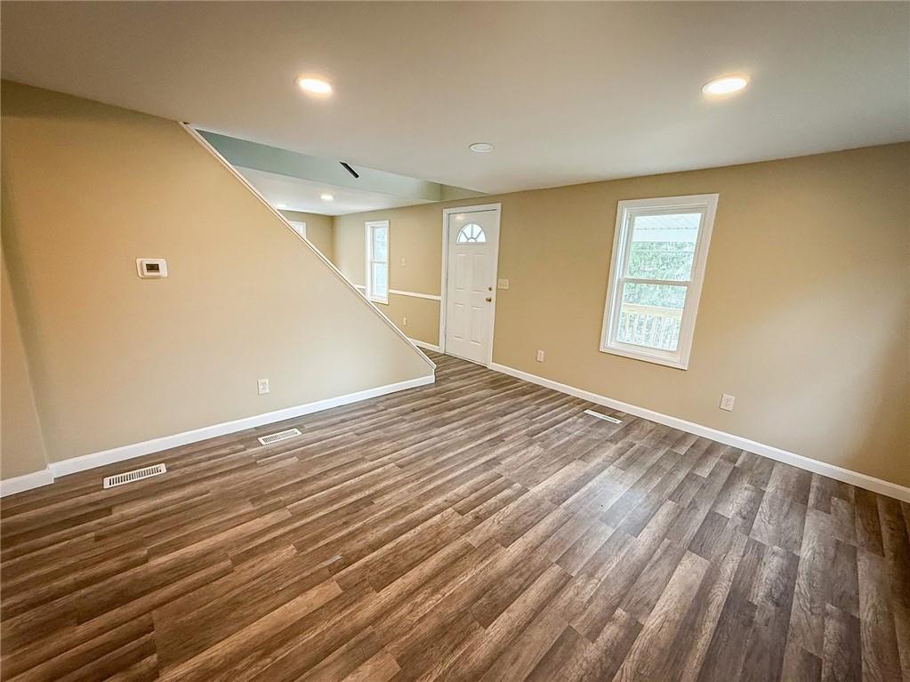 416 Oneida Valley Road Butler, PA 16001 - Photo 24 of 40 an empty room with wooden floor and windows