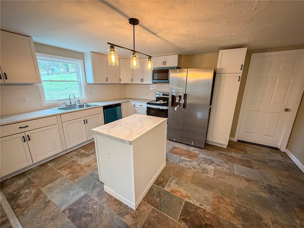 416 Oneida Valley Road Butler, PA 16001 - Photo 25 of 40 a kitchen with refrigerator cabinets and wooden floor