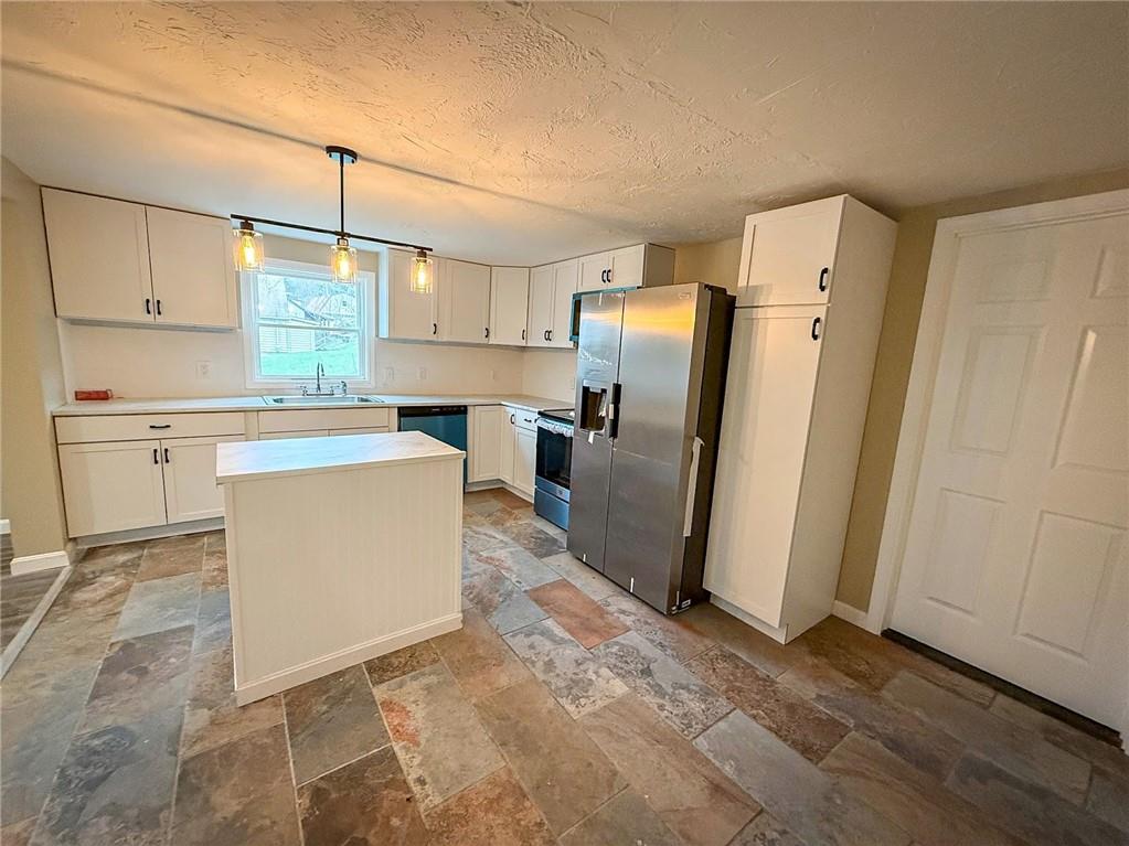 416 Oneida Valley Road Butler, PA 16001 - Photo 26 of 40 a kitchen with stainless steel appliances a refrigerator sink and microwave