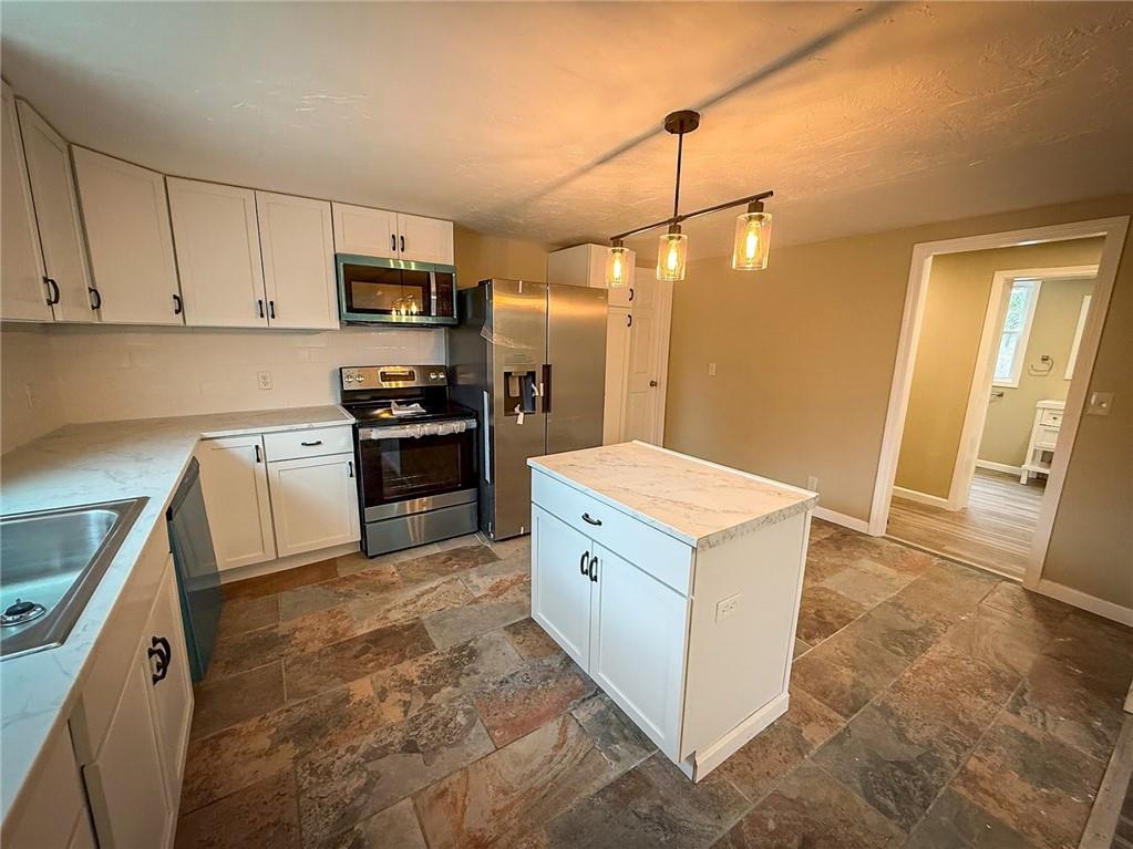 416 Oneida Valley Road Butler, PA 16001 - Photo 31 of 40 a kitchen with white cabinets and stainless steel appliances