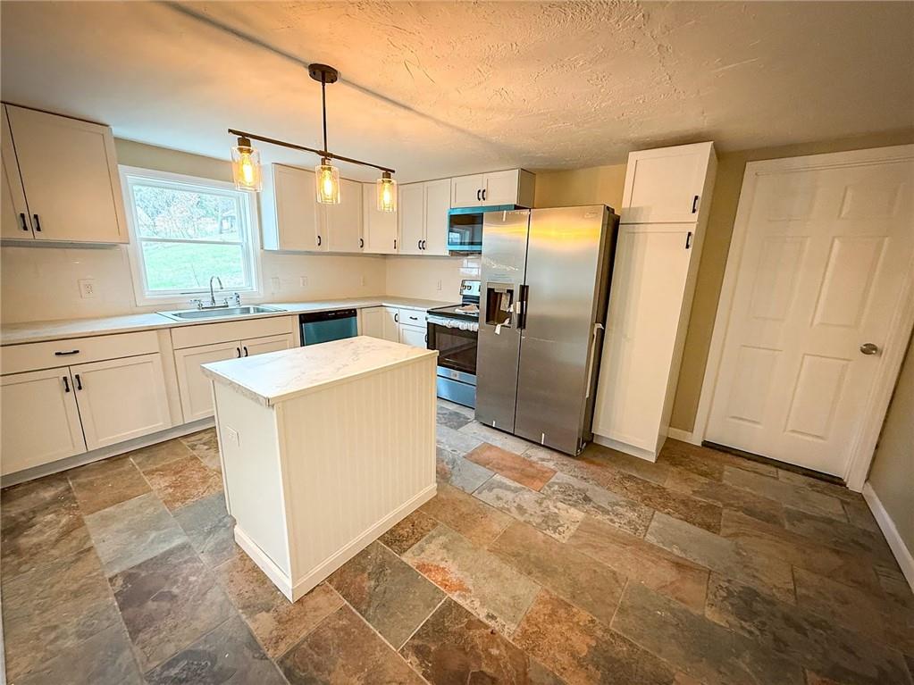 416 Oneida Valley Road Butler, PA 16001 - Photo 33 of 40 a kitchen with a refrigerator sink and stove
