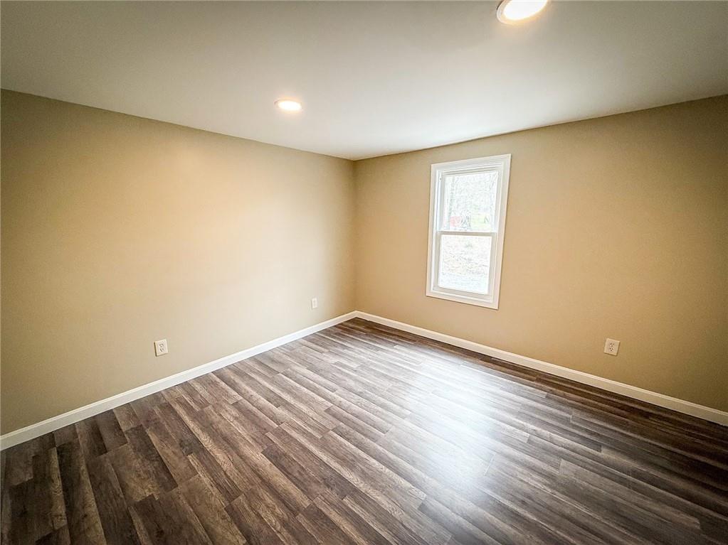416 Oneida Valley Road Butler, PA 16001 - Photo 5 of 40 a view of empty room with wooden floor and fan