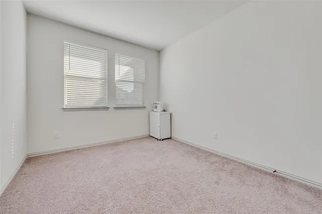 a bathroom with a granite countertop toilet sink and mirror