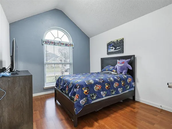 a bedroom with a bed and window