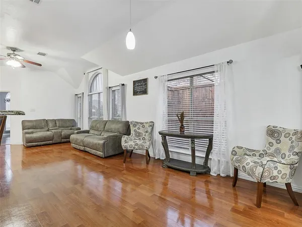 a living room with furniture and a window