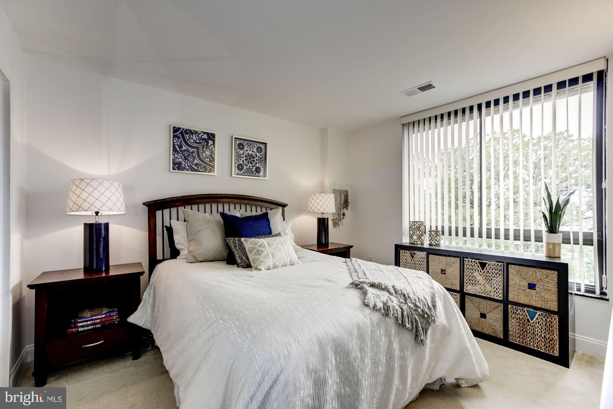 1808 Old Meadow Road, Unit 1403 McLean, VA 22102 - Photo 16 of 30 a bedroom with a bed and a window