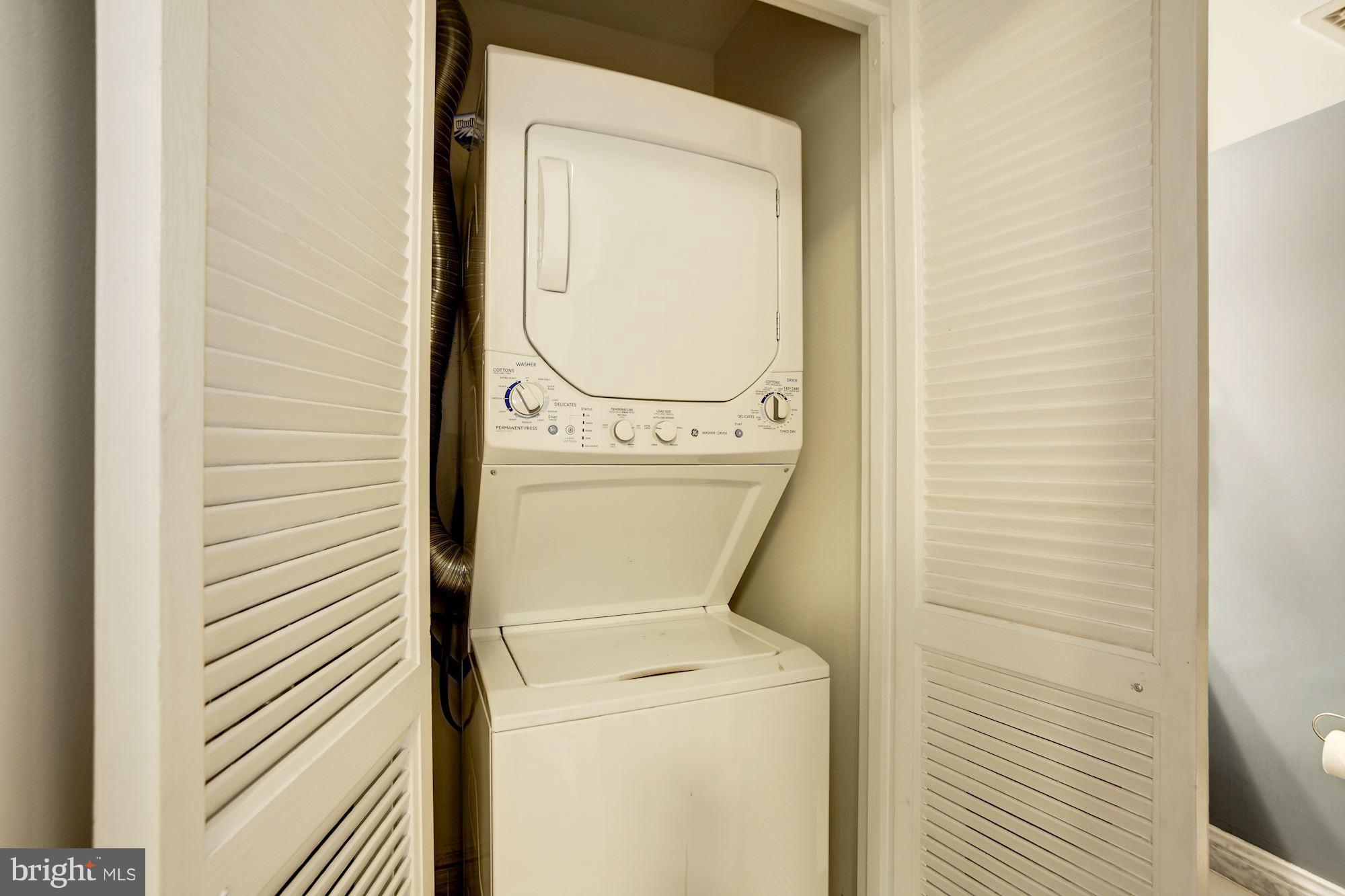 1808 Old Meadow Road, Unit 1403 McLean, VA 22102 - Photo 22 of 30 a utility room with dryer and washer