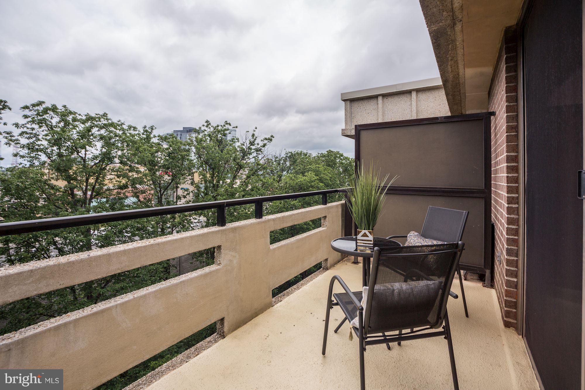 1808 Old Meadow Road, Unit 1403 McLean, VA 22102 - Photo 23 of 30 a view of a chairs and table in the balcony