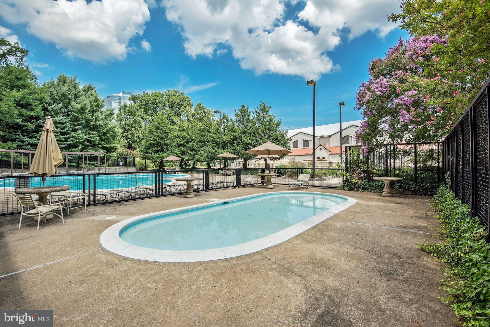 1808 Old Meadow Road, Unit 1403 McLean, VA 22102 - Photo 27 of 30 a view of a swimming pool with outdoor seating