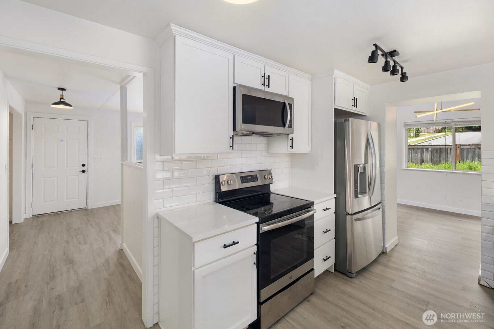 101 161st Street Southeast Bothell, WA 98012 - Photo 14 of 34 a kitchen with stainless steel appliances a refrigerator stove and microwave