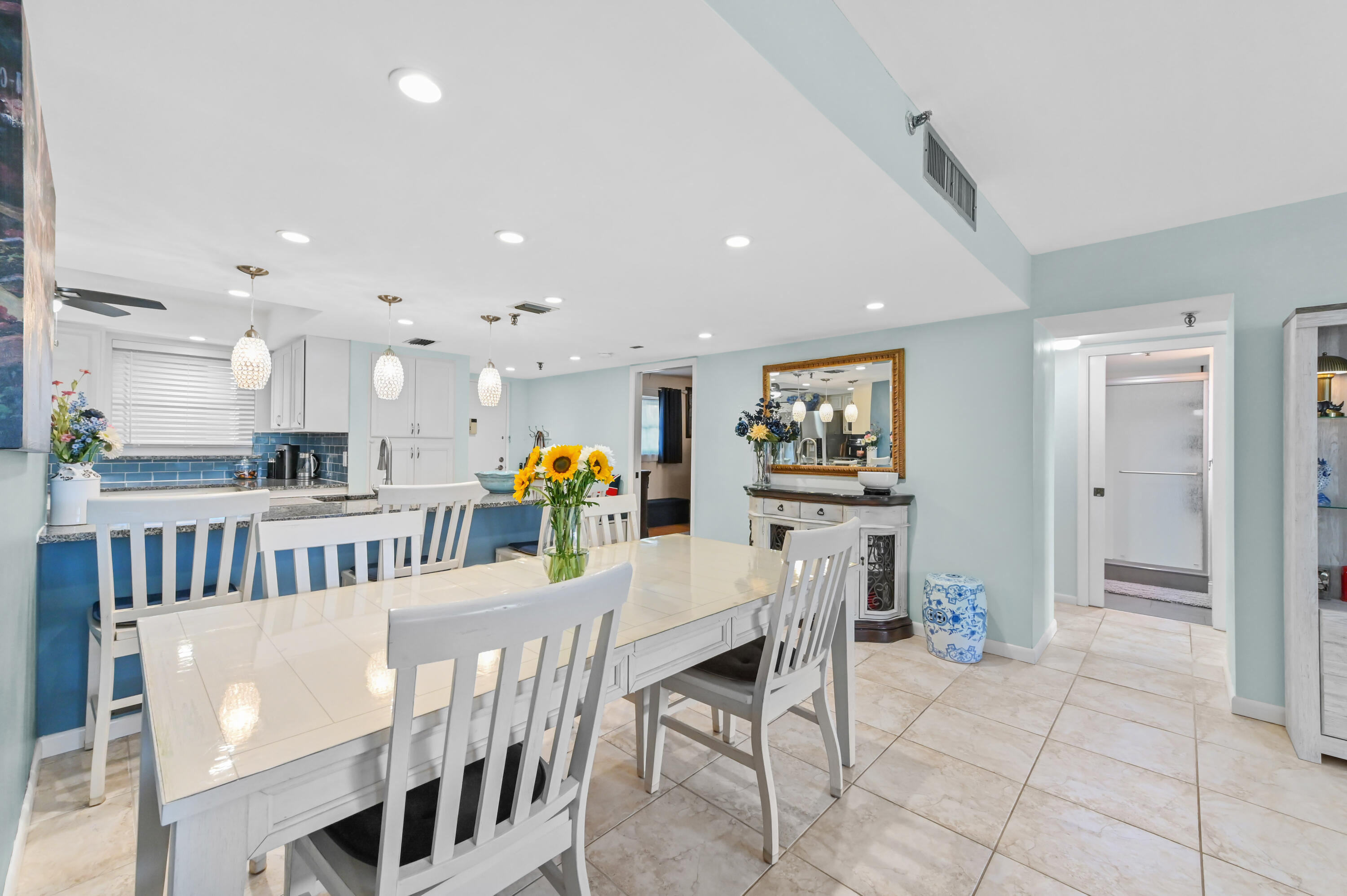198 Northwest 67th Street, Unit 207 Boca Raton, FL 33487 - Photo 12 of 43 a dining room with furniture and a table