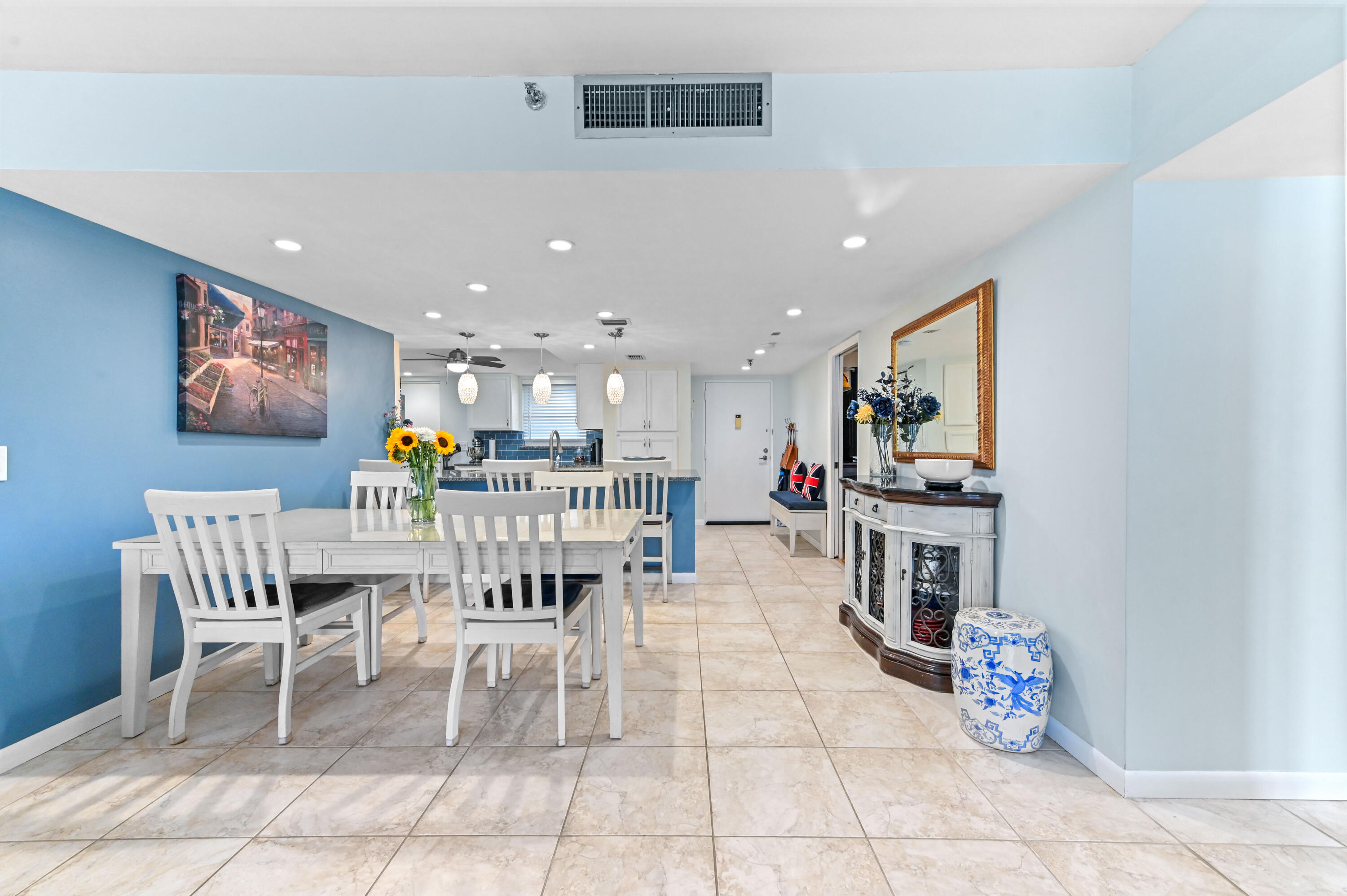 198 Northwest 67th Street, Unit 207 Boca Raton, FL 33487 - Photo 14 of 43 a dining room with furniture and a floor to ceiling window