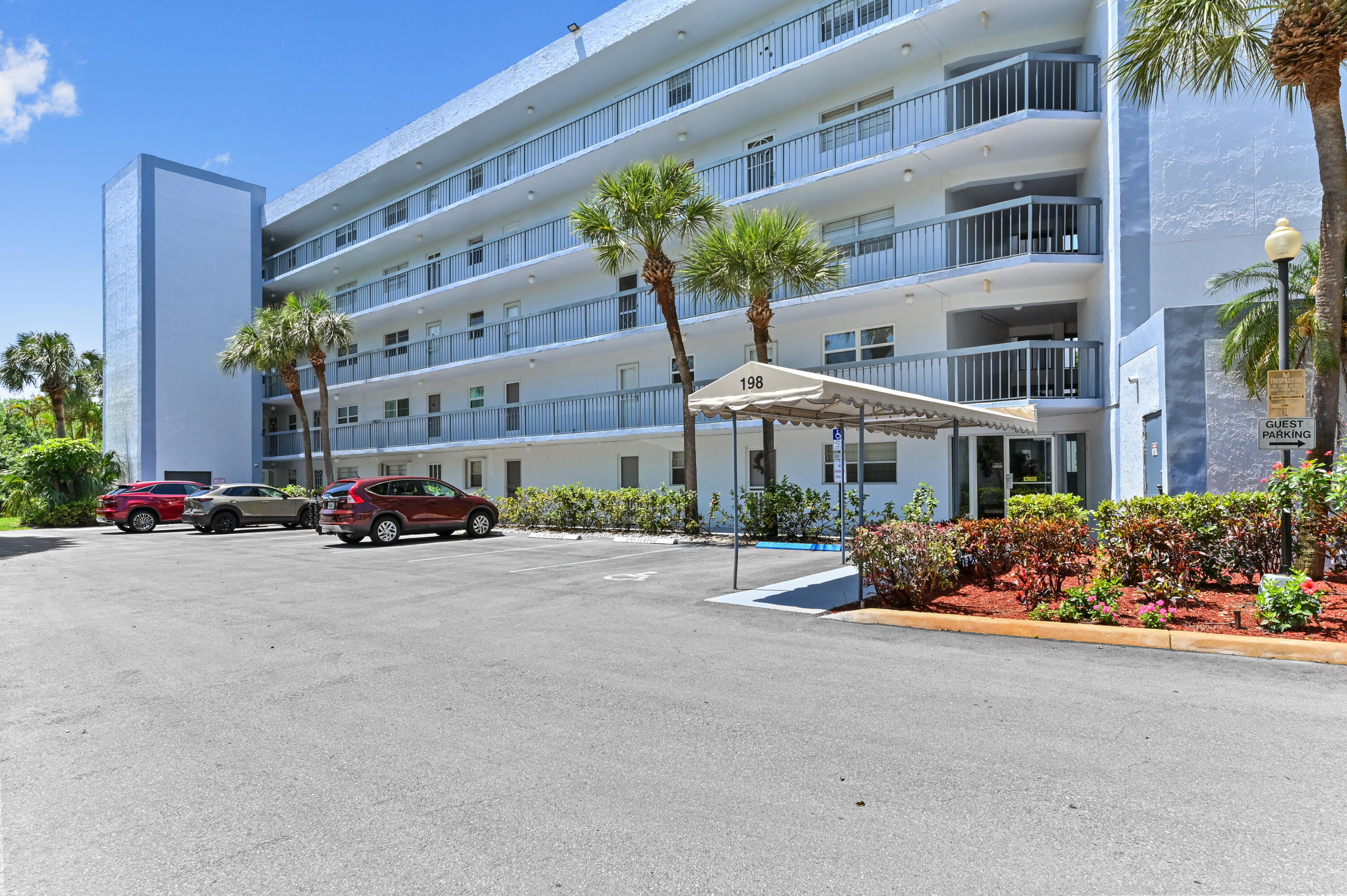 198 Northwest 67th Street, Unit 207 Boca Raton, FL 33487 - Photo 2 of 43 a front view of a building with street view