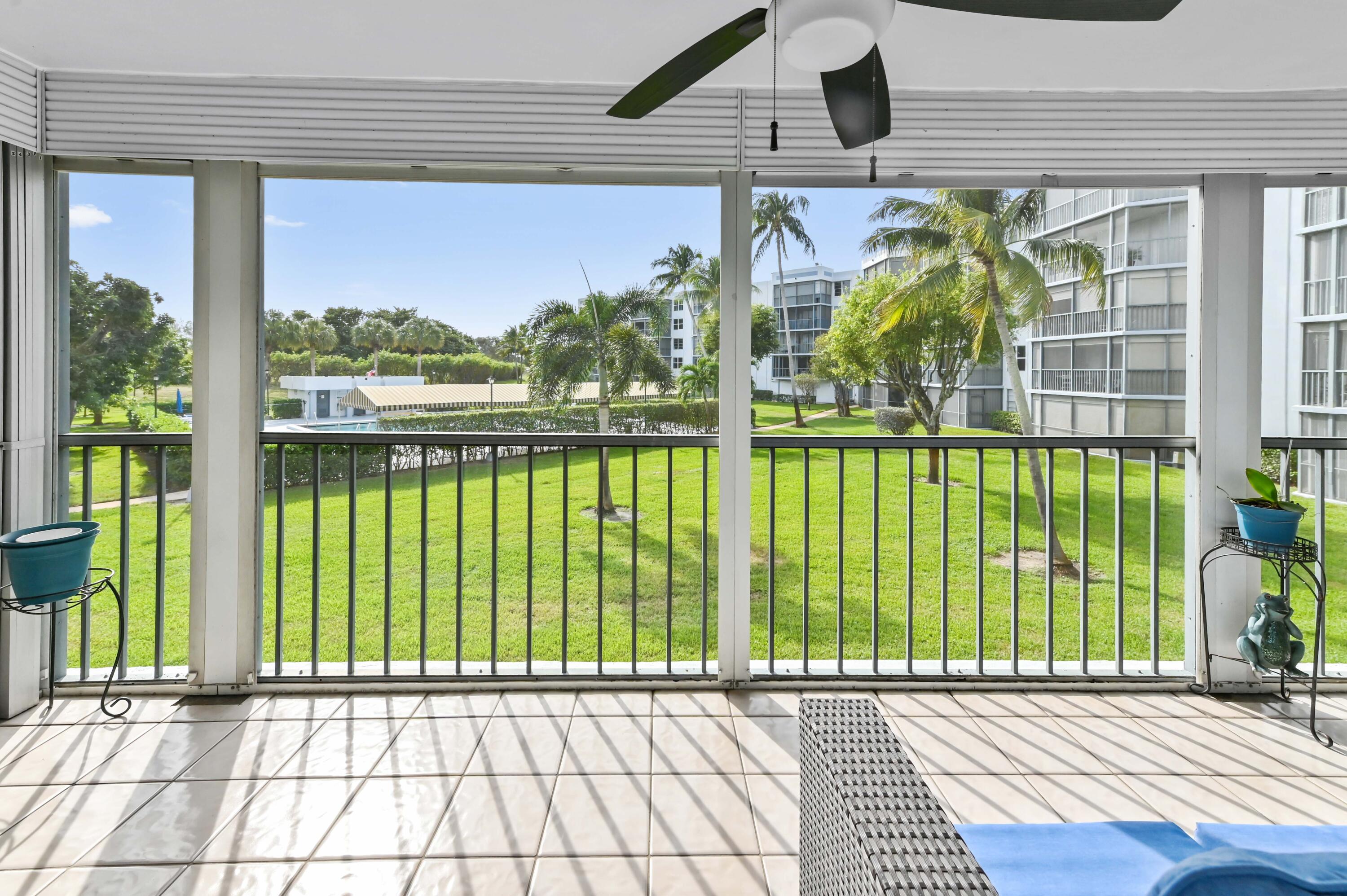 198 Northwest 67th Street, Unit 207 Boca Raton, FL 33487 - Photo 30 of 43 a view of a house with a porch