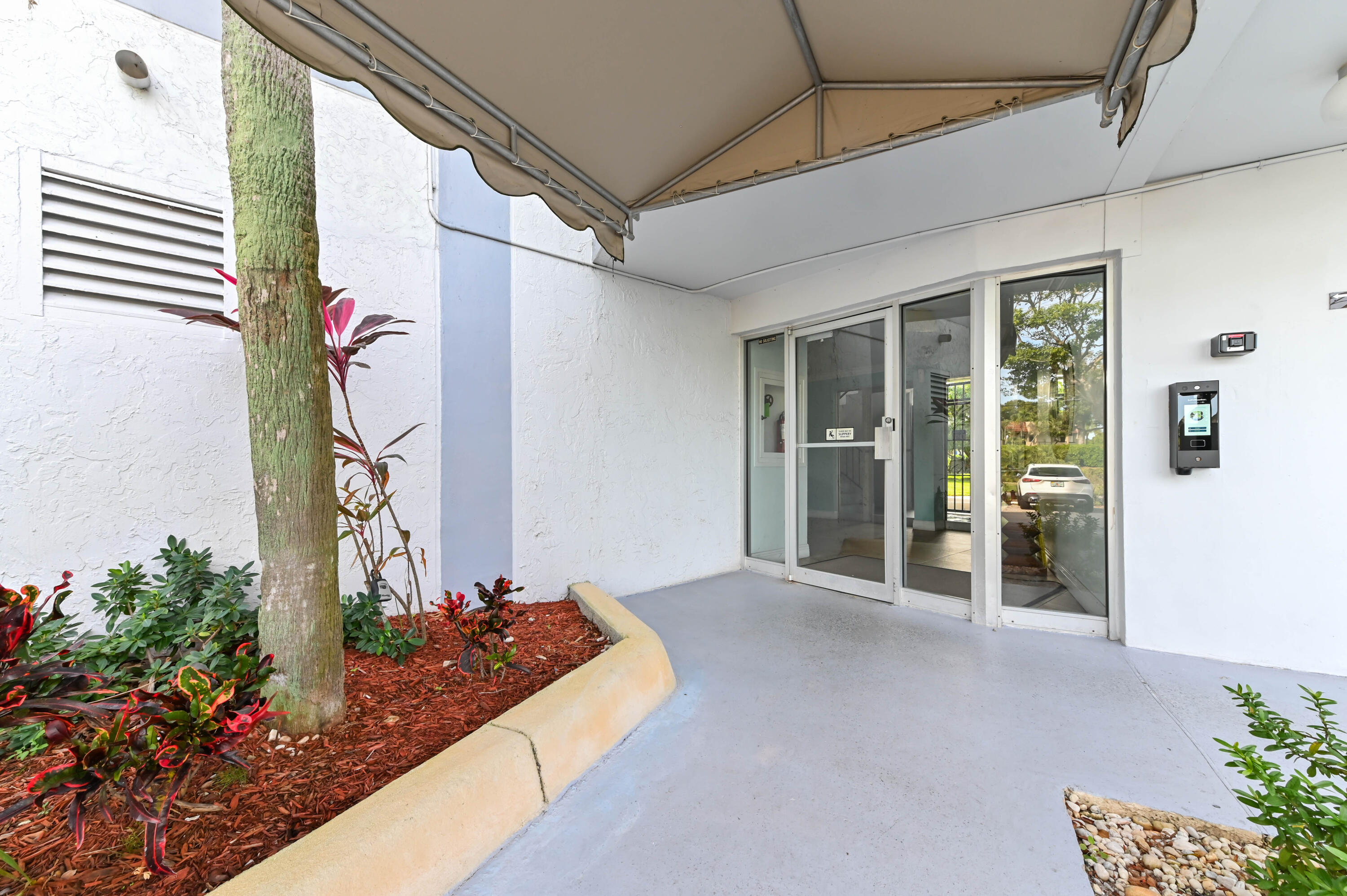 198 Northwest 67th Street, Unit 207 Boca Raton, FL 33487 - Photo 3 of 43 a house view with a outdoor space