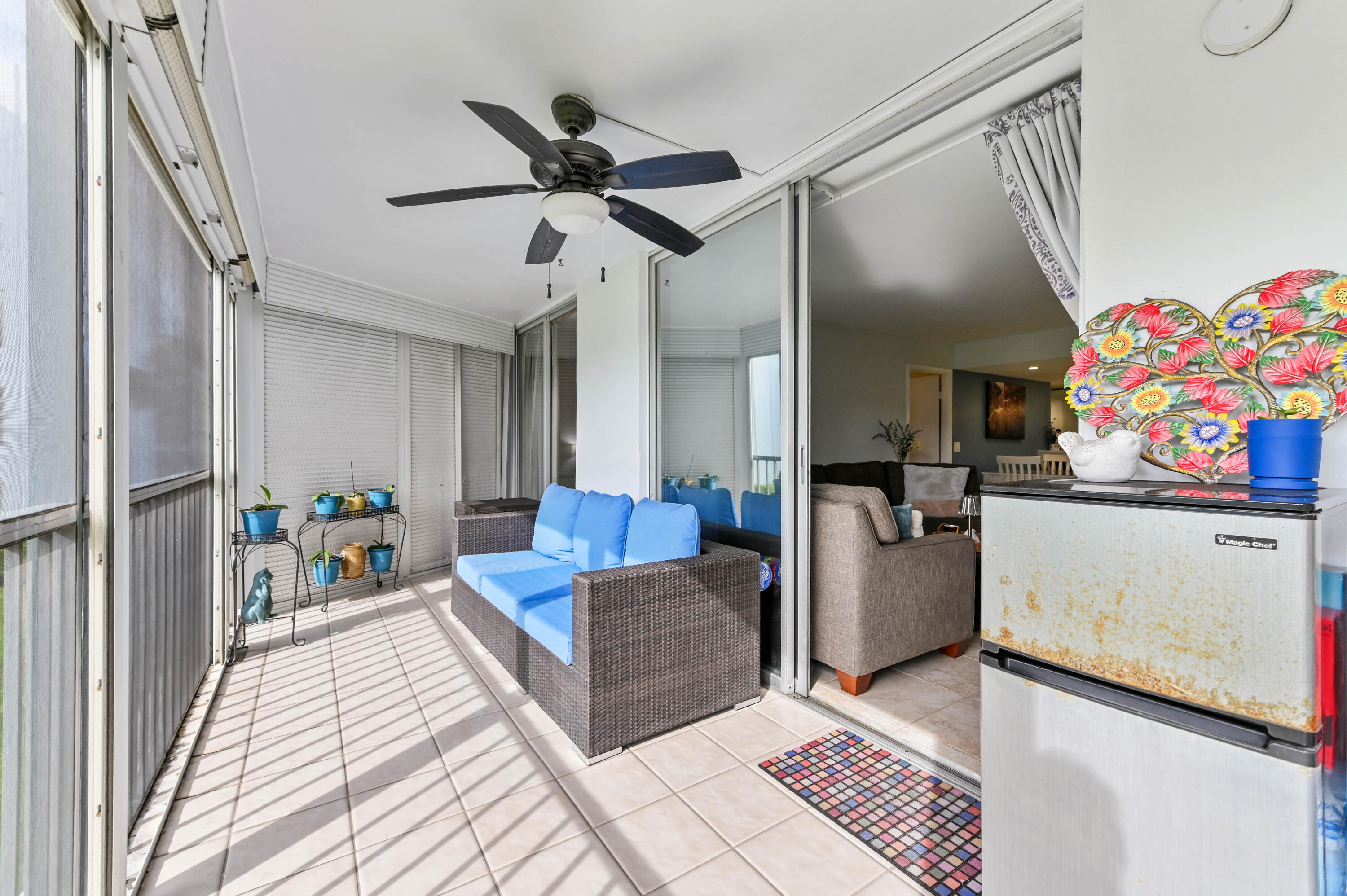 198 Northwest 67th Street, Unit 207 Boca Raton, FL 33487 - Photo 33 of 43 a living room with furniture and a rug