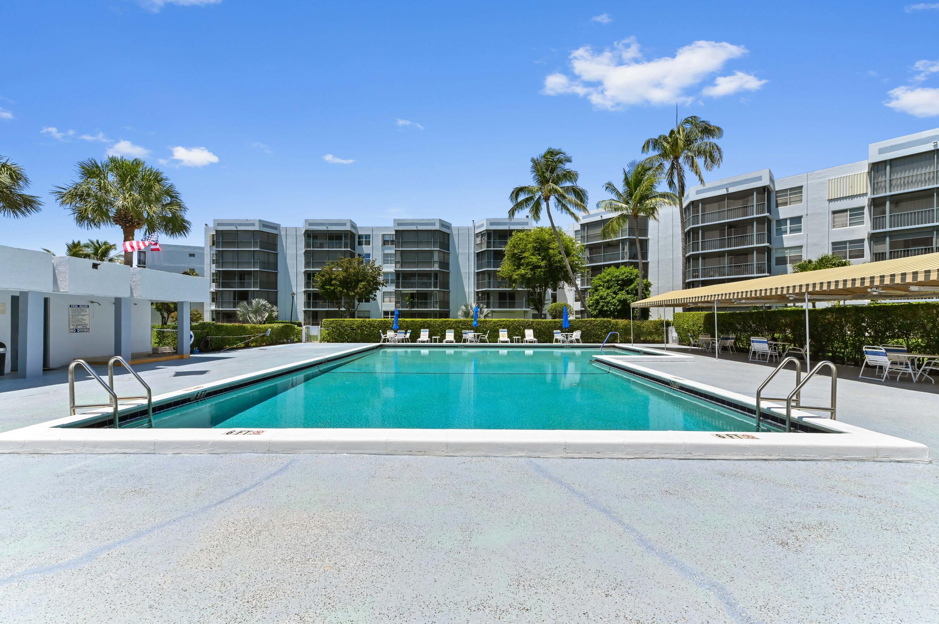 198 Northwest 67th Street, Unit 207 Boca Raton, FL 33487 - Photo 39 of 43 a view of pool with outdoor seating