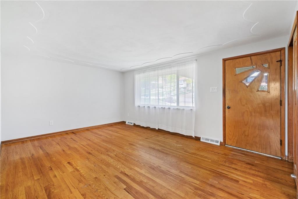 1317 Cathell Road Pittsburgh, PA 15236 - Photo 6 of 32 The gleaming hardwood floors add warmth to the space.
