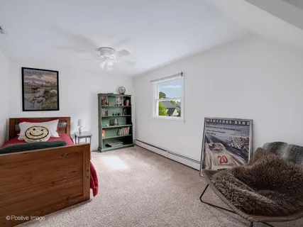 a living room with furniture and cabinets