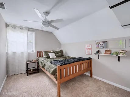 a bedroom with a bed and cabinets