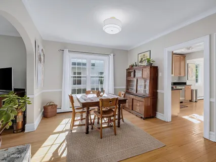 a dining room with furniture and window