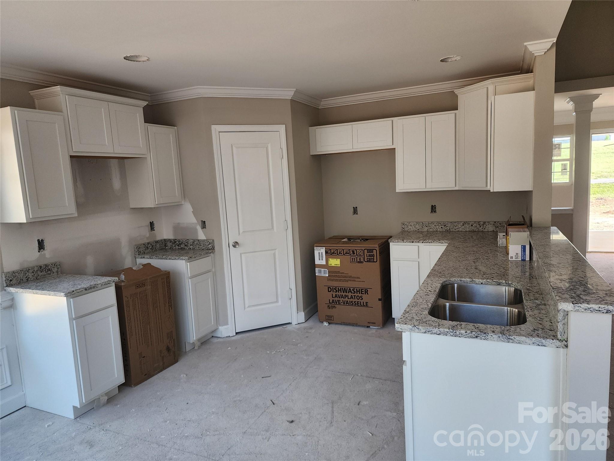 5405 Springs Road, Unit 3 Conover, NC 28613 - Photo 15 of 28 a kitchen with granite countertop a sink stove and cabinets