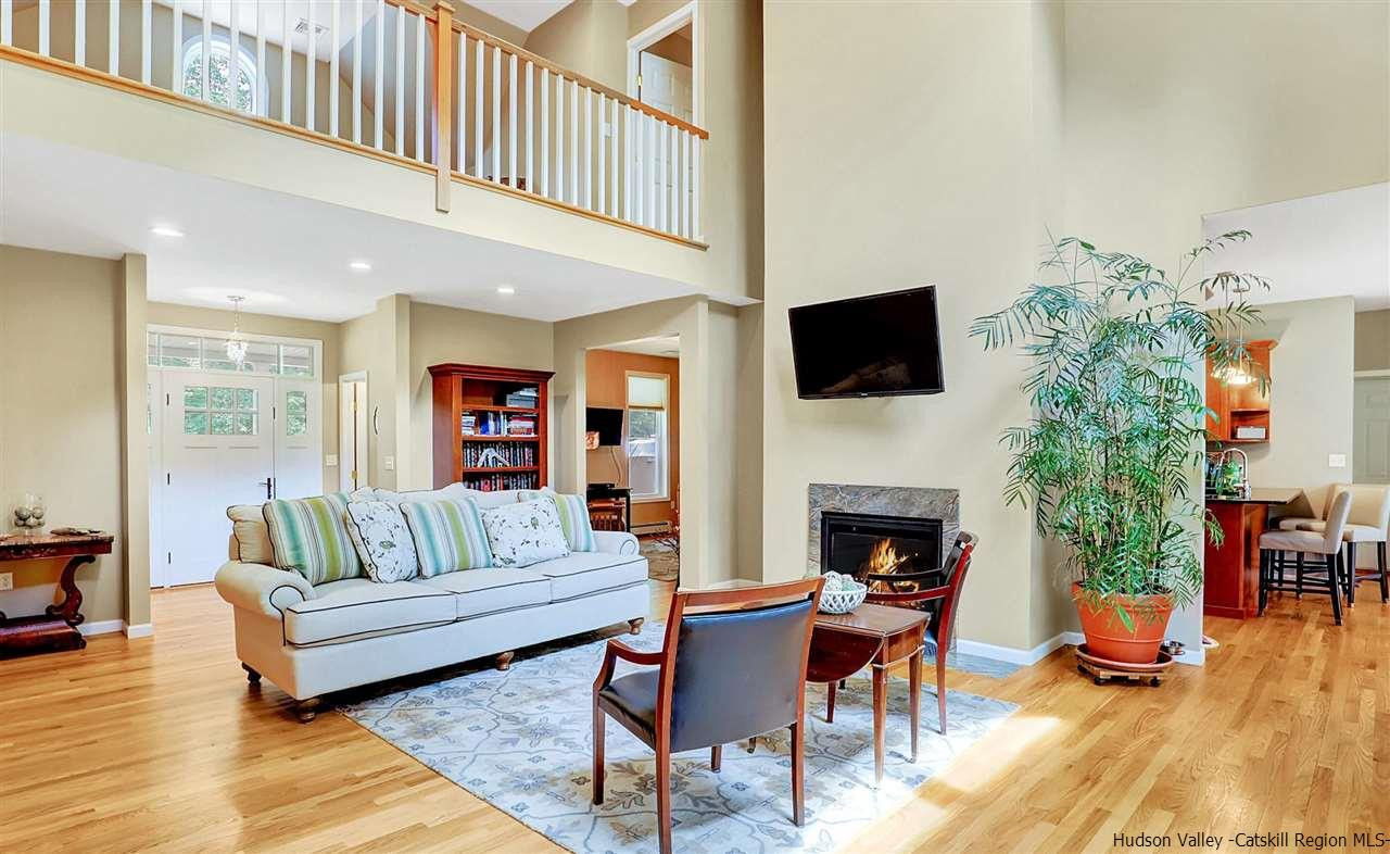194 Harry Wells Road Saugerties, NY 12477 - Photo 11 of 35 a living room with furniture a fireplace and a flat screen tv