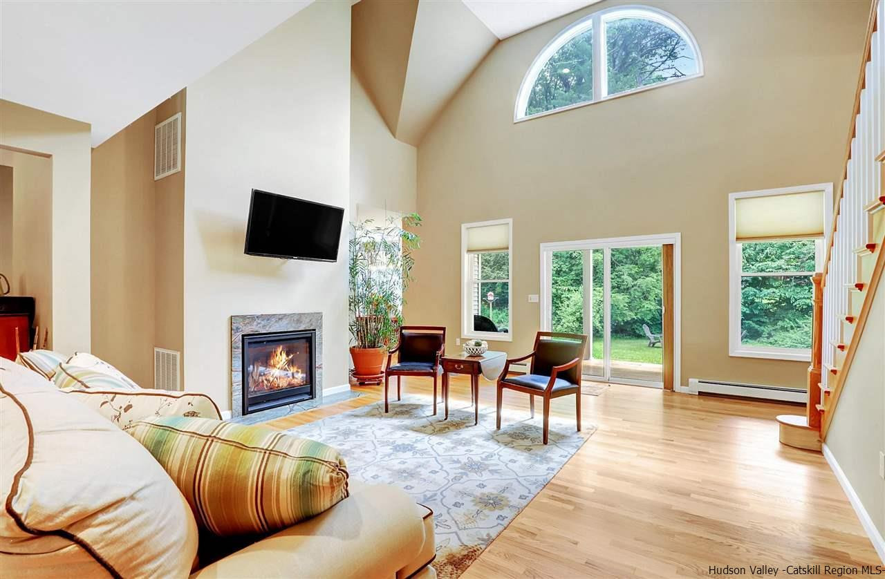194 Harry Wells Road Saugerties, NY 12477 - Photo 12 of 35 a living room with furniture and a fireplace