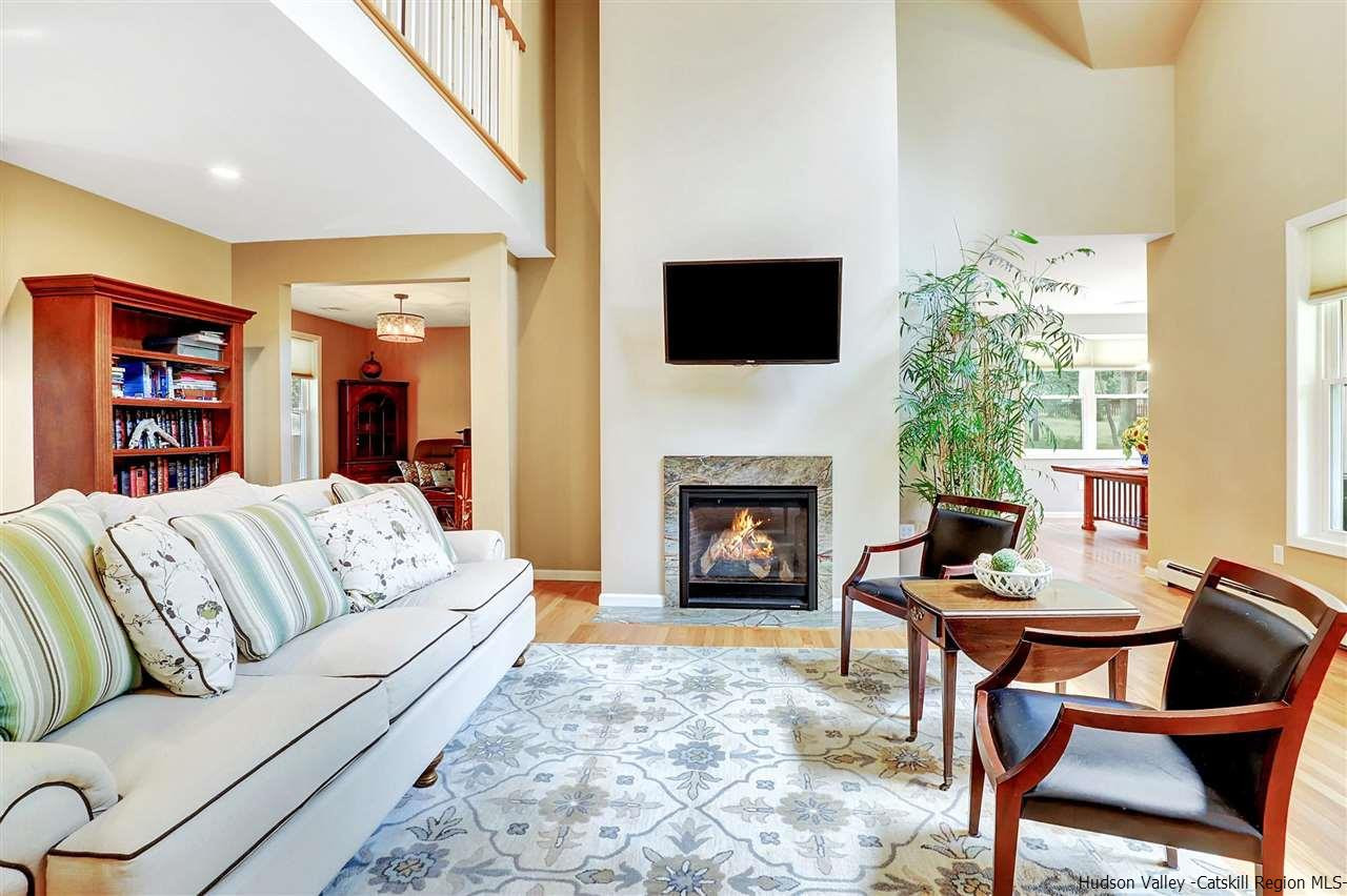 194 Harry Wells Road Saugerties, NY 12477 - Photo 13 of 35 a living room with furniture fireplace and flat screen tv