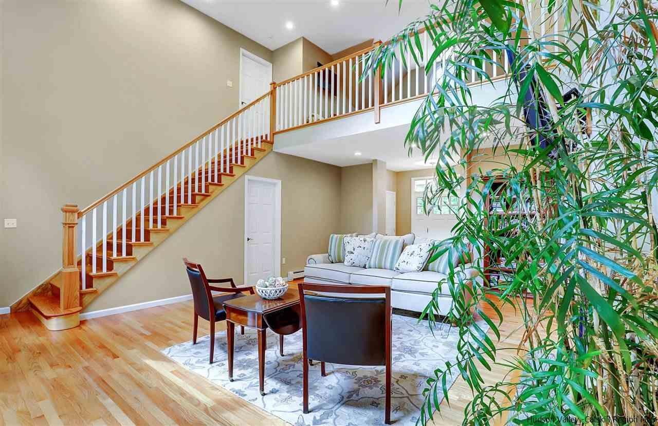 194 Harry Wells Road Saugerties, NY 12477 - Photo 14 of 35 a dining room with furniture entryway and wooden floor