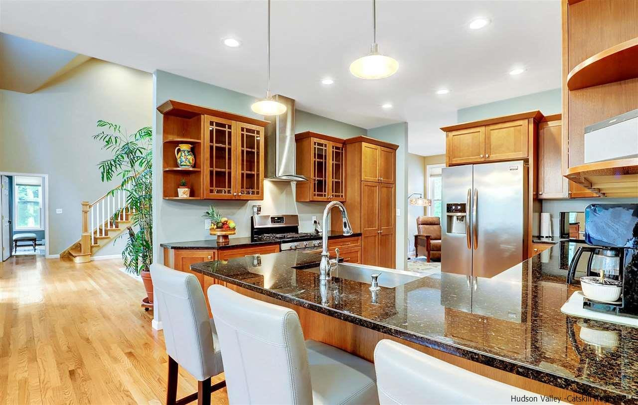 194 Harry Wells Road Saugerties, NY 12477 - Photo 16 of 35 a kitchen with stainless steel appliances granite countertop a sink and refrigerator