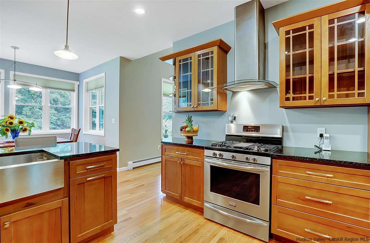 194 Harry Wells Road Saugerties, NY 12477 - Photo 18 of 35 a kitchen with stainless steel appliances granite countertop a stove and a sink