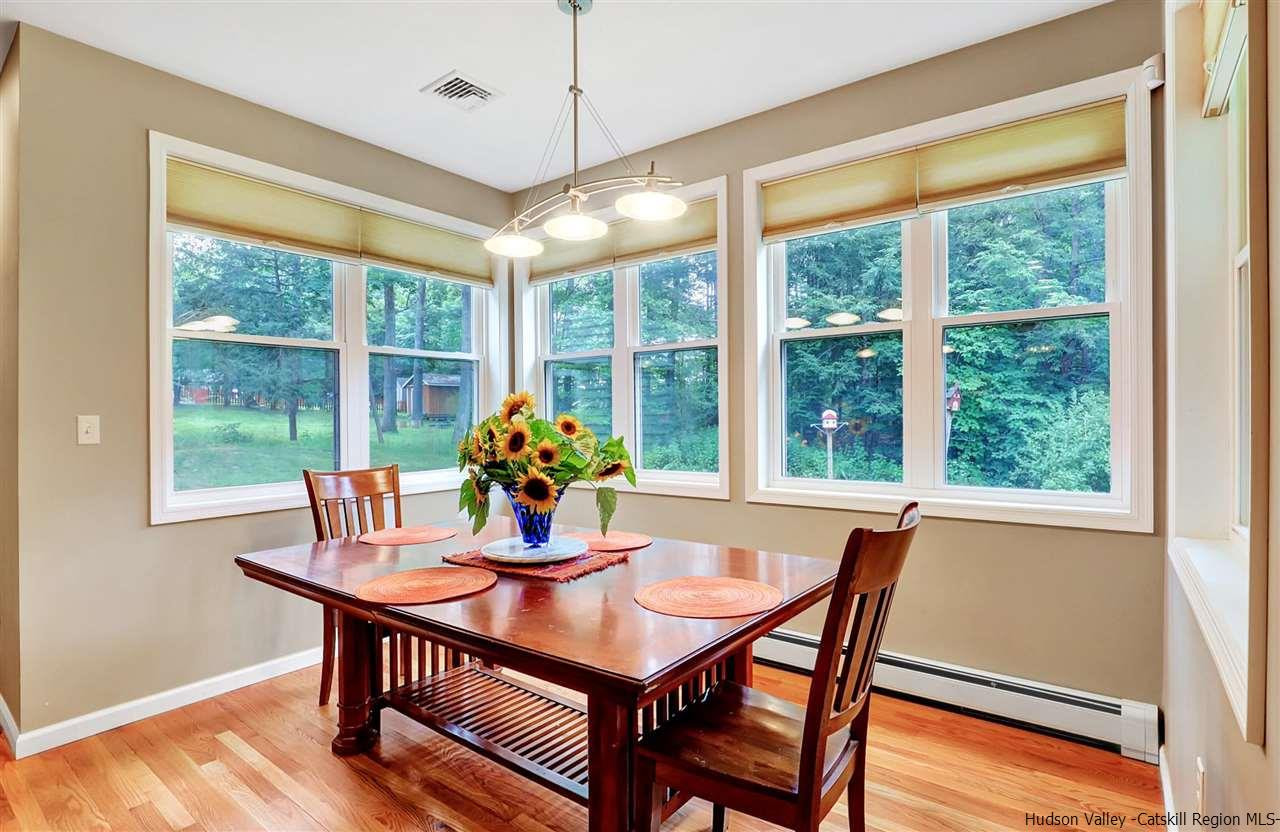 194 Harry Wells Road Saugerties, NY 12477 - Photo 19 of 35 a view of a dining room with furniture window and outside view