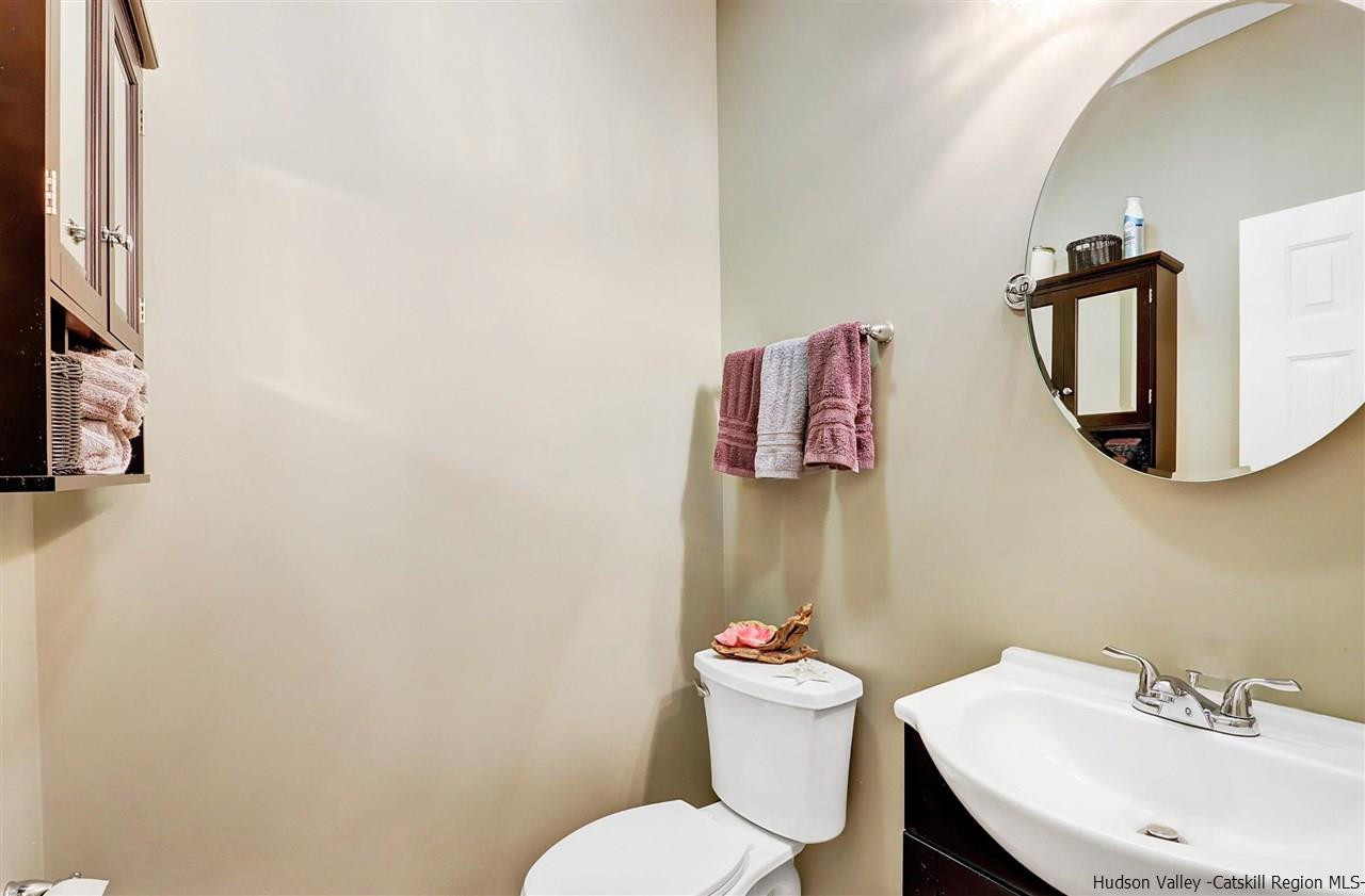 194 Harry Wells Road Saugerties, NY 12477 - Photo 20 of 35 a white toilet sitting next to a bathroom sink