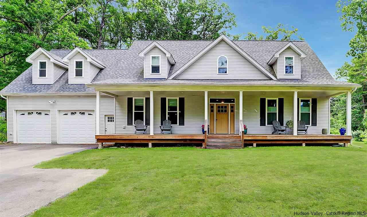 194 Harry Wells Road Saugerties, NY 12477 - Photo 2 of 35 a front view of a house with a garden and porch