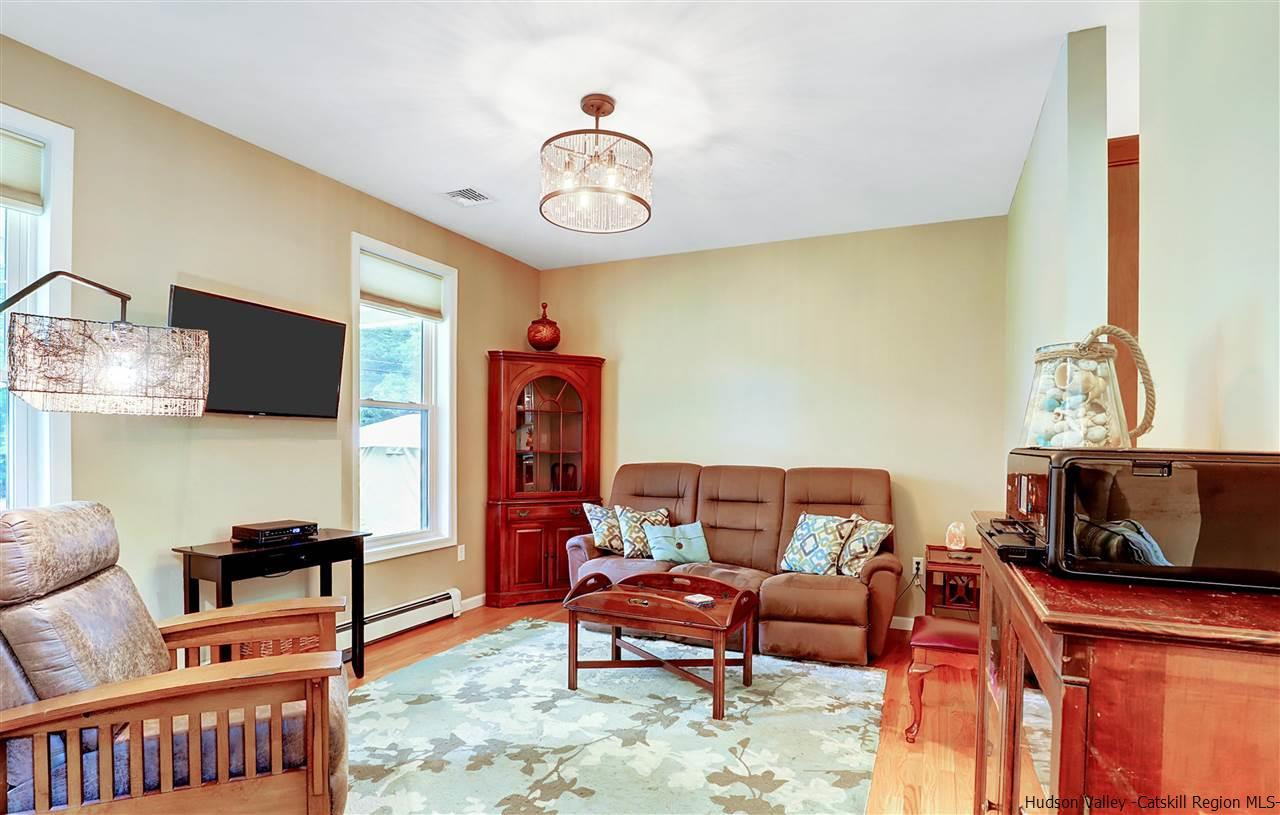 194 Harry Wells Road Saugerties, NY 12477 - Photo 22 of 35 a living room with furniture and a flat screen tv