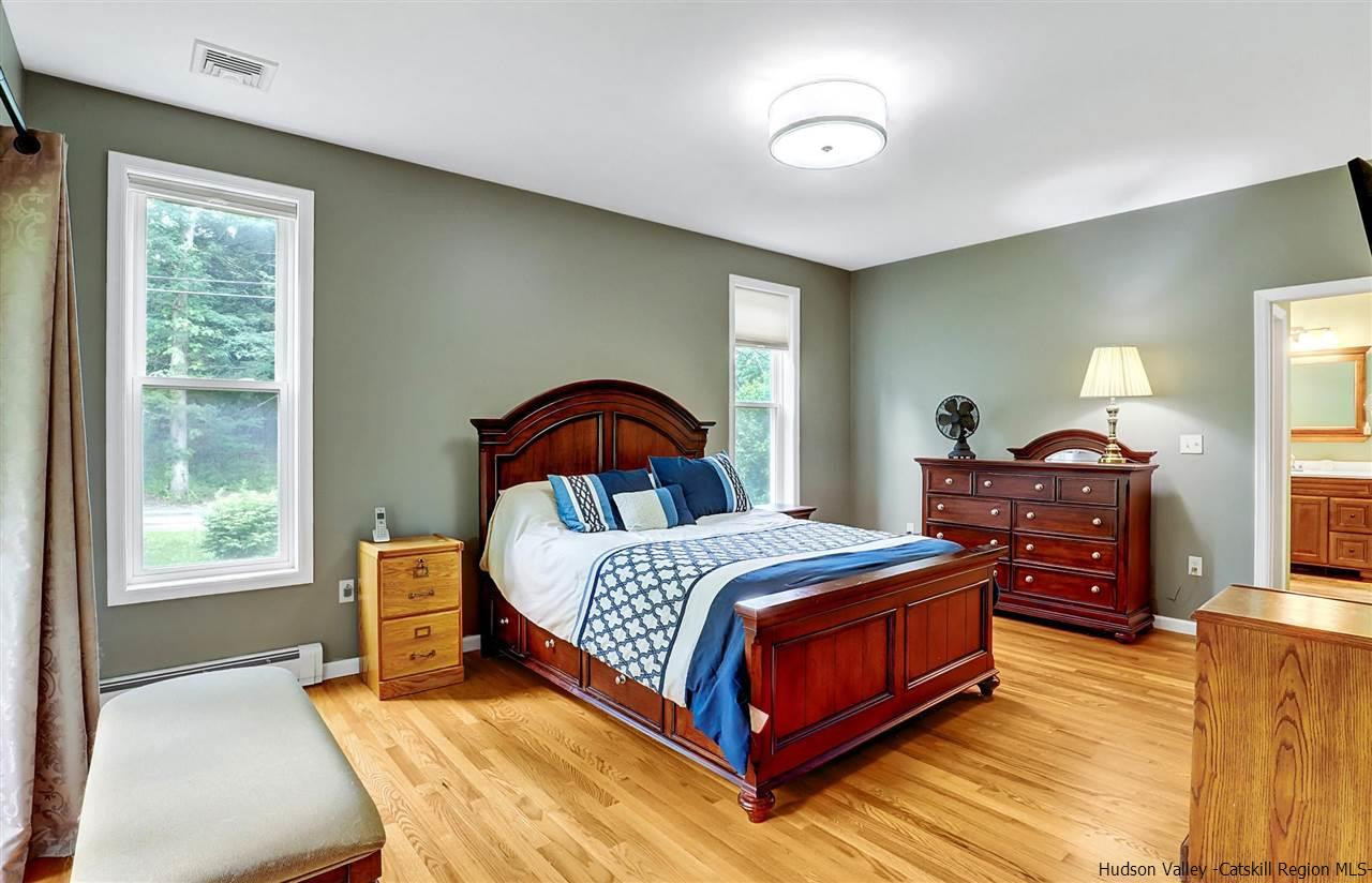 194 Harry Wells Road Saugerties, NY 12477 - Photo 23 of 35 a bedroom with a bed and a large window