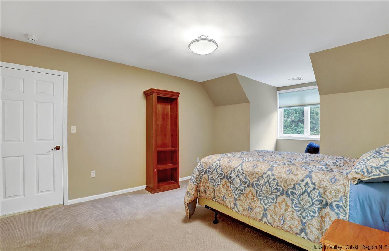 194 Harry Wells Road Saugerties, NY 12477 - Photo 29 of 35 a bedroom with a bed and a window