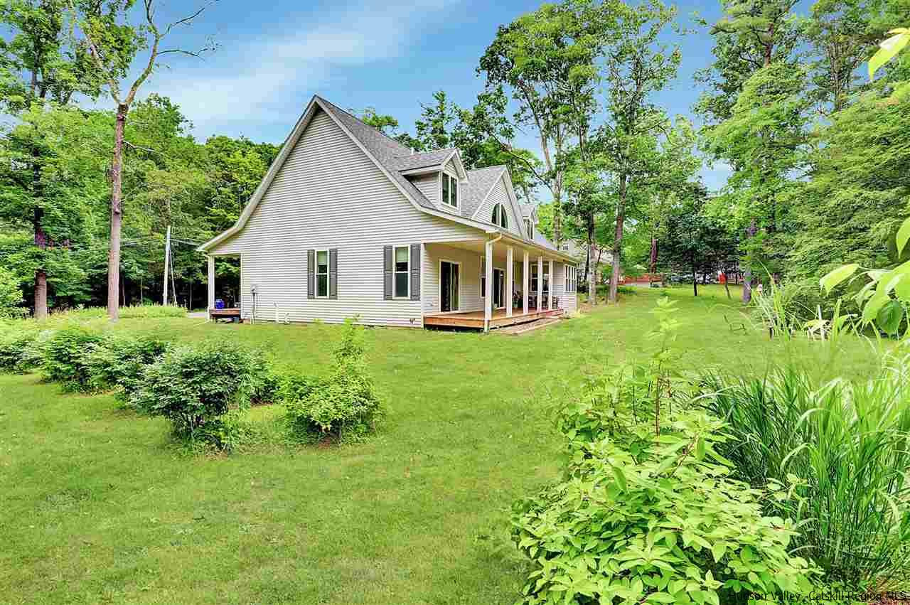 194 Harry Wells Road Saugerties, NY 12477 - Photo 5 of 35 a front view of a house with a yard and potted plants