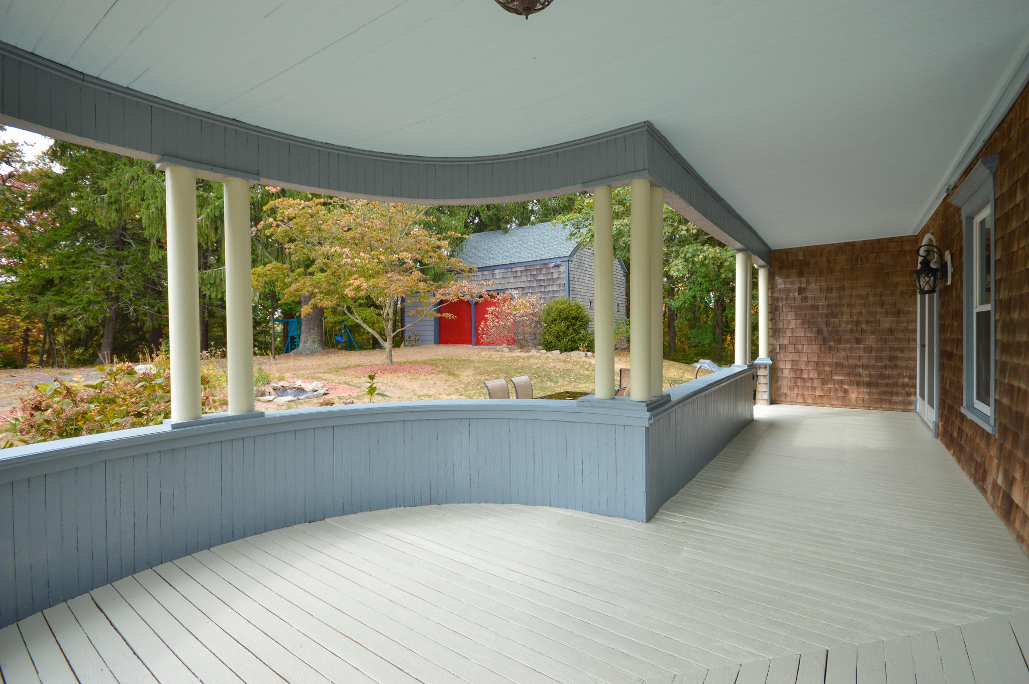 576 Old County Road Westport, MA 02790 - Photo 24 of 28 a living room with large windows and a table