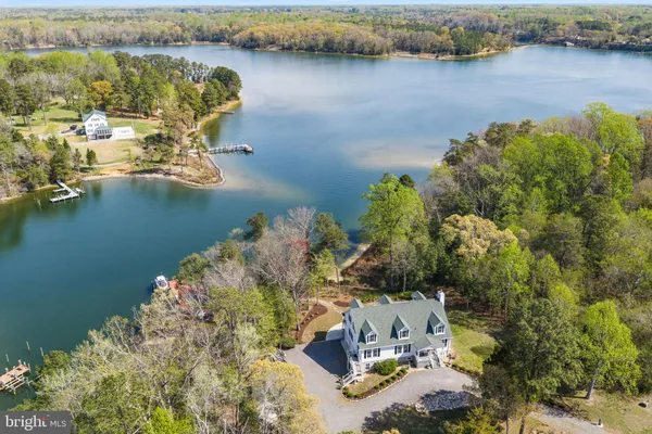 a aerial view of a house with swimming pool and sitting area