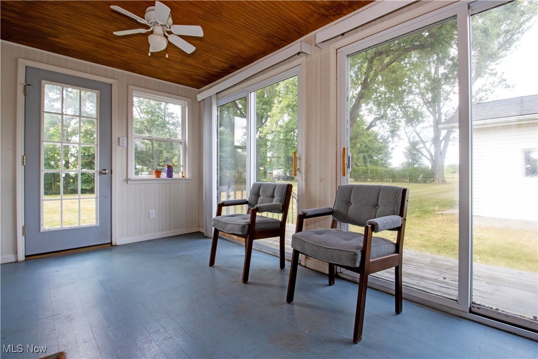 8984 Spencer Road Homerville, OH 44235 - Photo 12 of 27 Sunroom featuring wood ceiling and a wealth of natural light