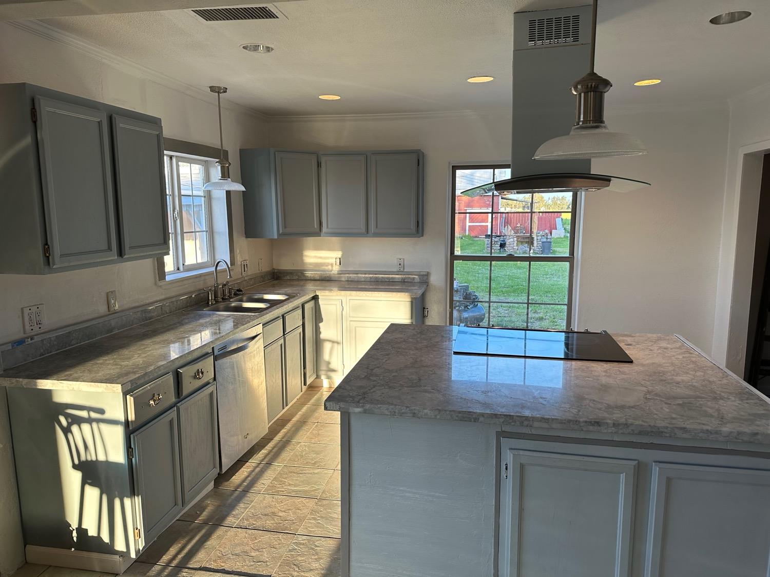 7271 Elk Grove Florin Road Sacramento, CA 95829 - Photo 13 of 49 a kitchen with stainless steel appliances granite countertop a sink a stove and a refrigerator
