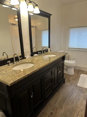 a bedroom with a bed and wall painting